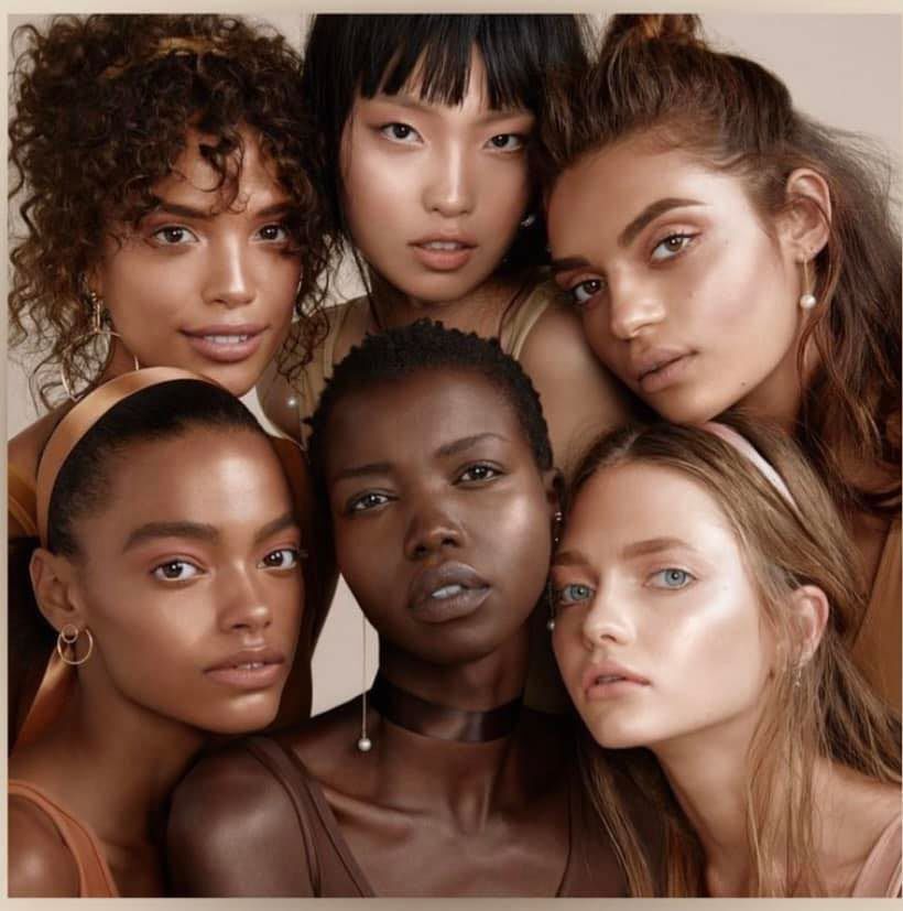 A group of women are posing for a picture together