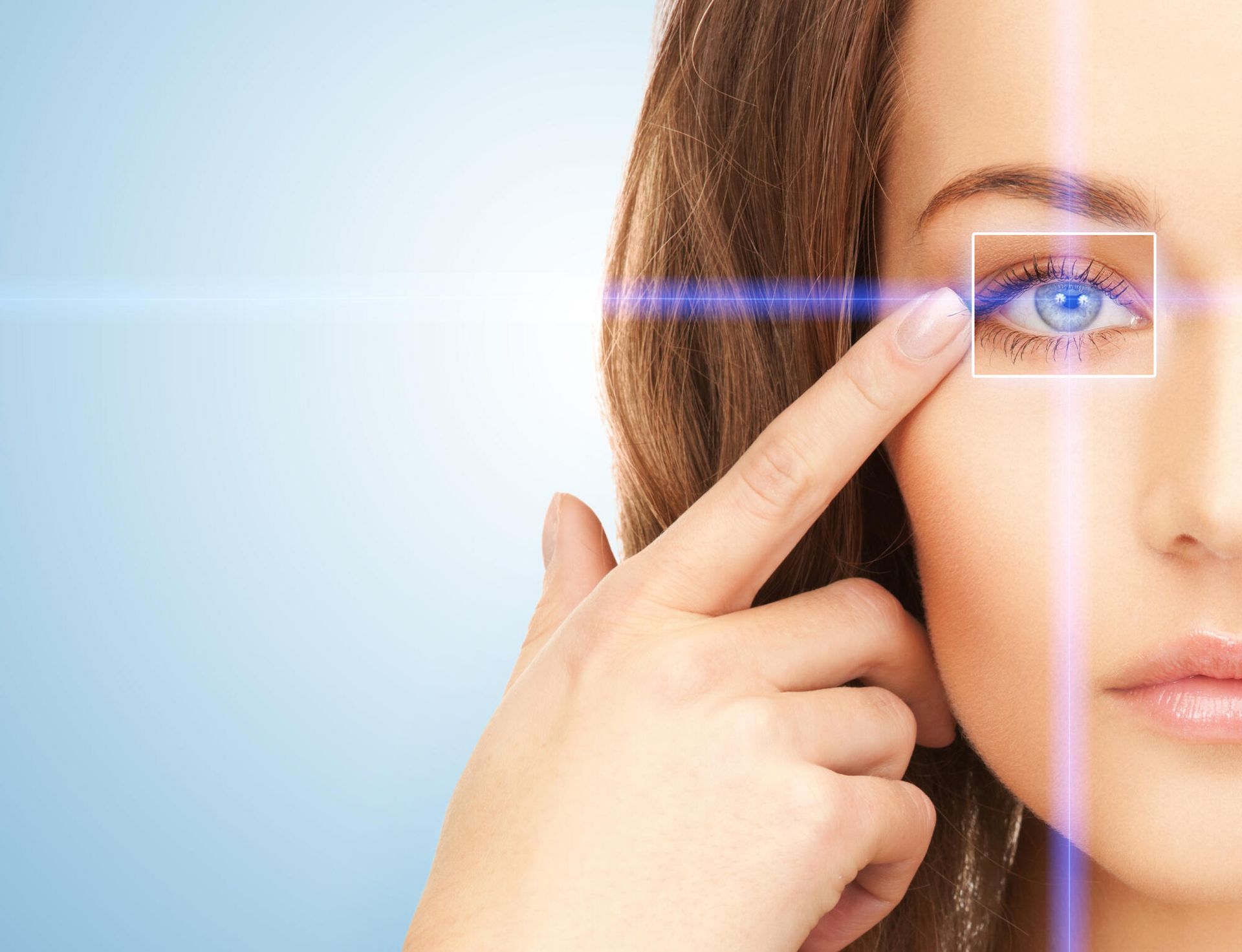 A woman 's eye is being scanned by a laser beam.