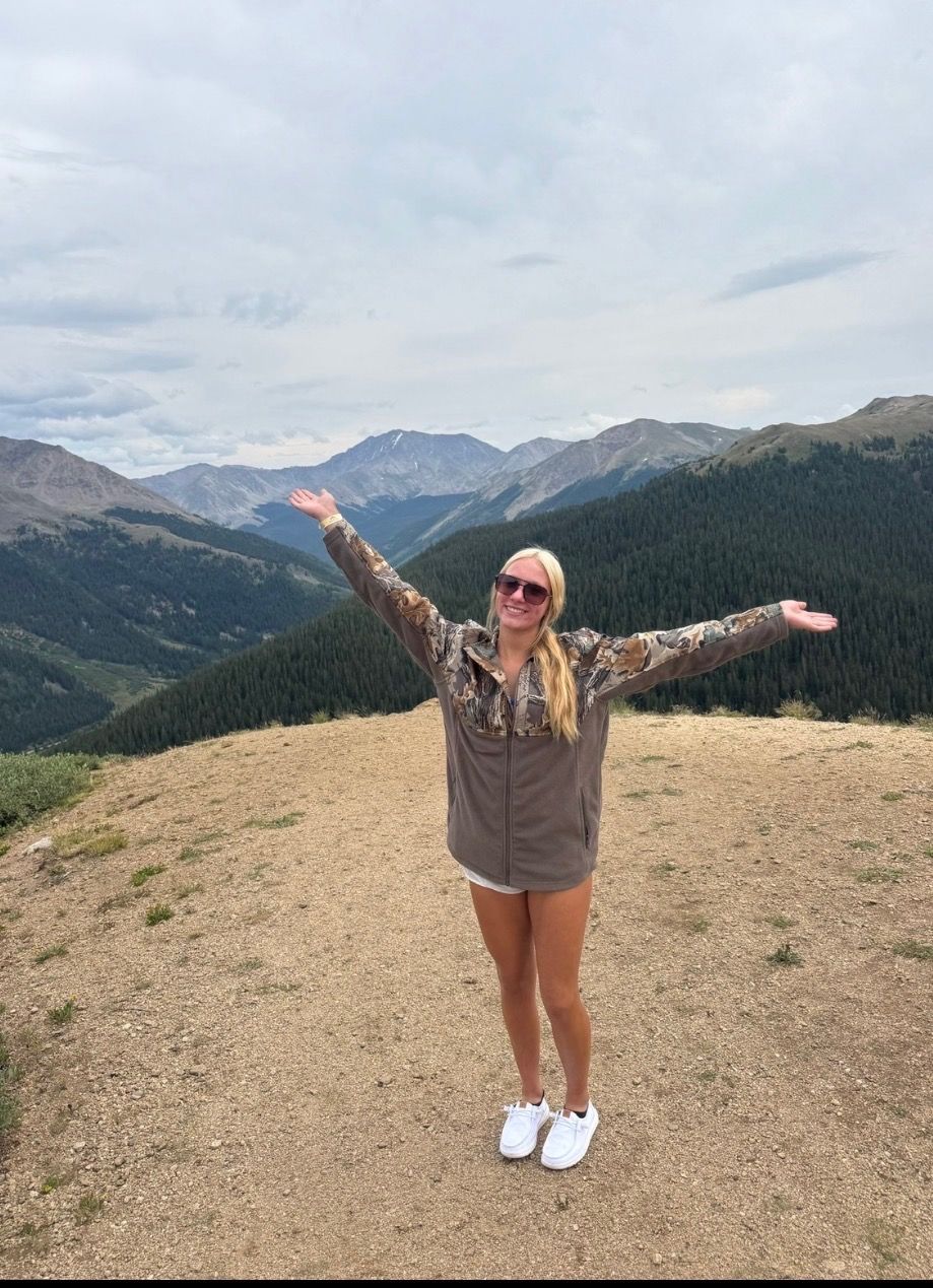 A young woman posing in a locker room.