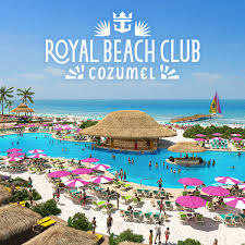 Aerial view of Royal Beach Club Cozumel with a large pool, cabana, and beach umbrellas.