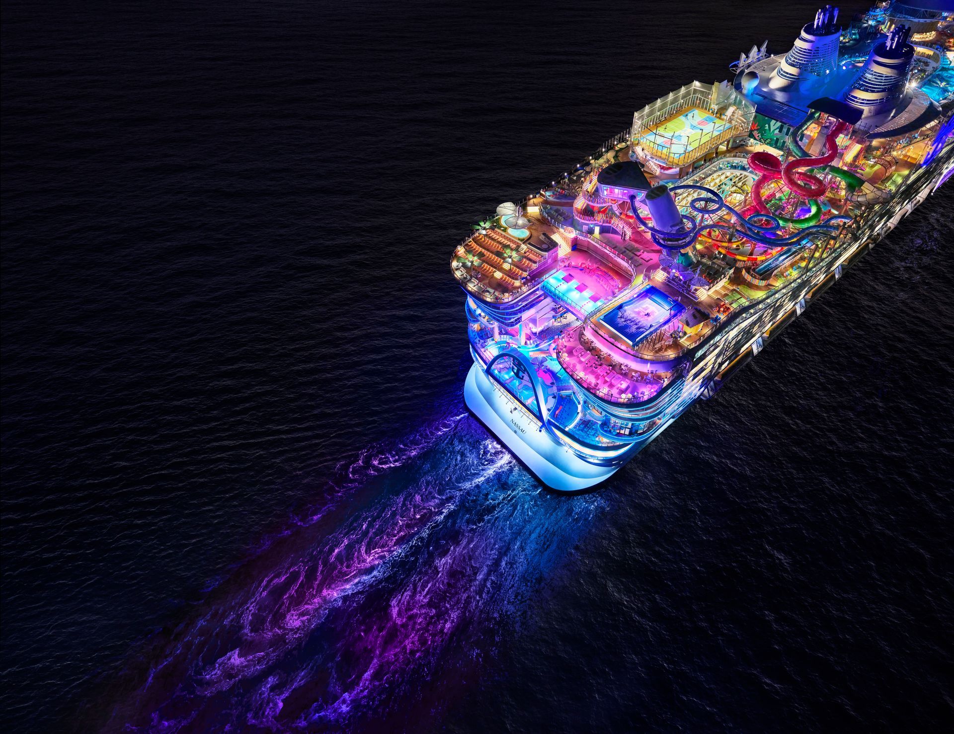 A nighttime ariel view of Icon of the Seas, one of the largest cruise ships in the world as of 2025.