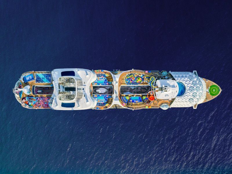 Overhead view of Wonder of the Seas, showing multiple decks with pools and recreational areas.