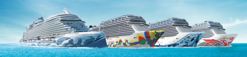 Several cruise ships on a blue ocean under a clear sky.