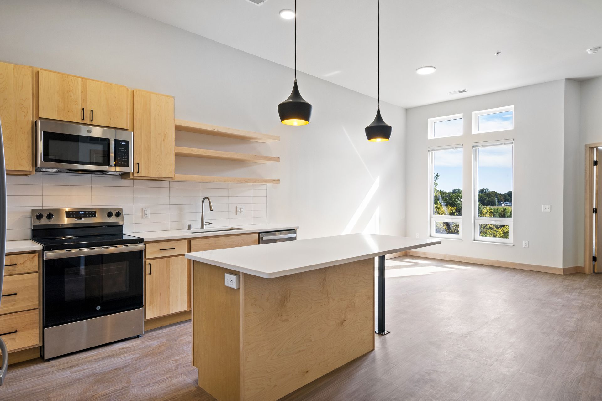 There is a large island in the middle of the kitchen.