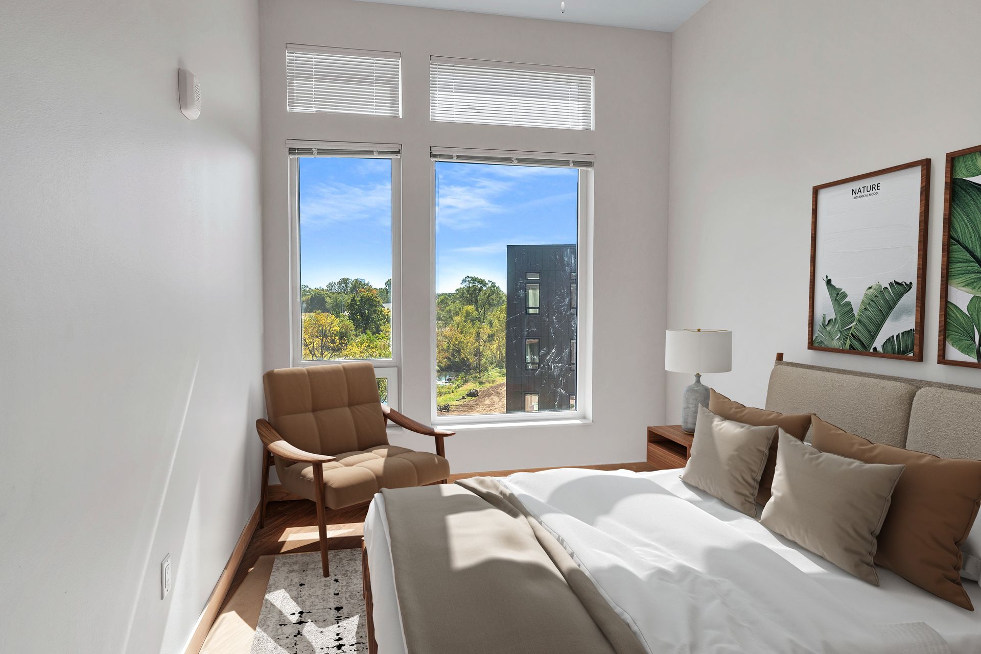 A bedroom with a bed , chair , and window.