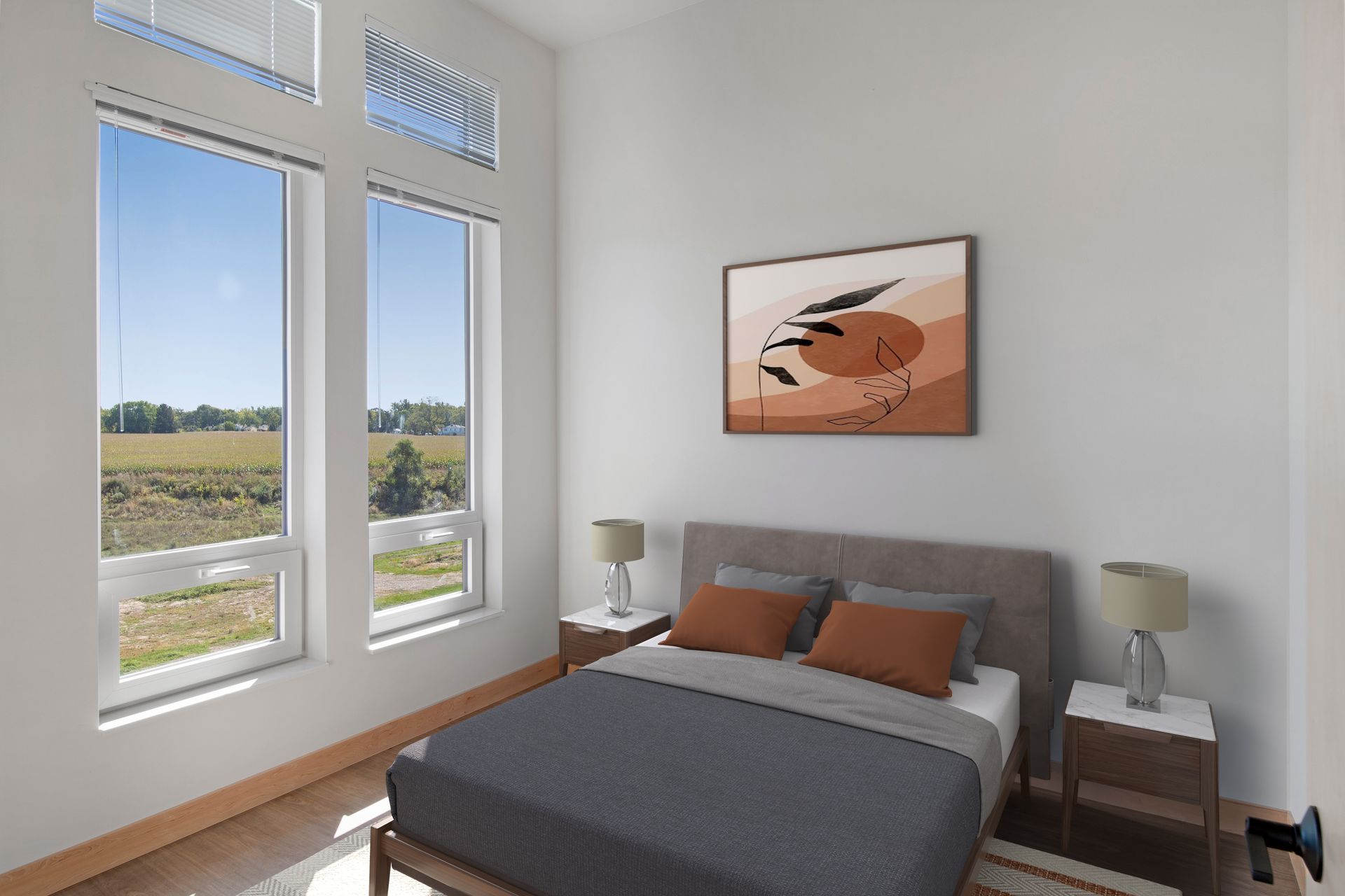 A bedroom with a large bed and a painting on the wall