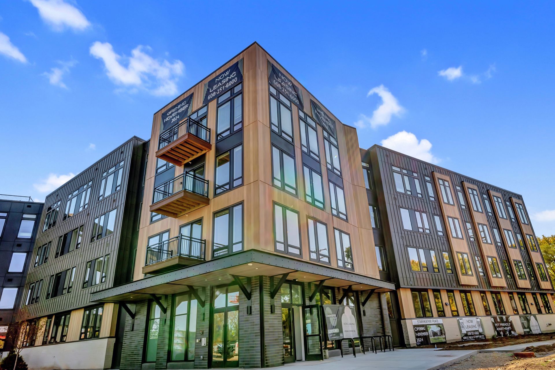 A large apartment building with a lot of windows and balconies.