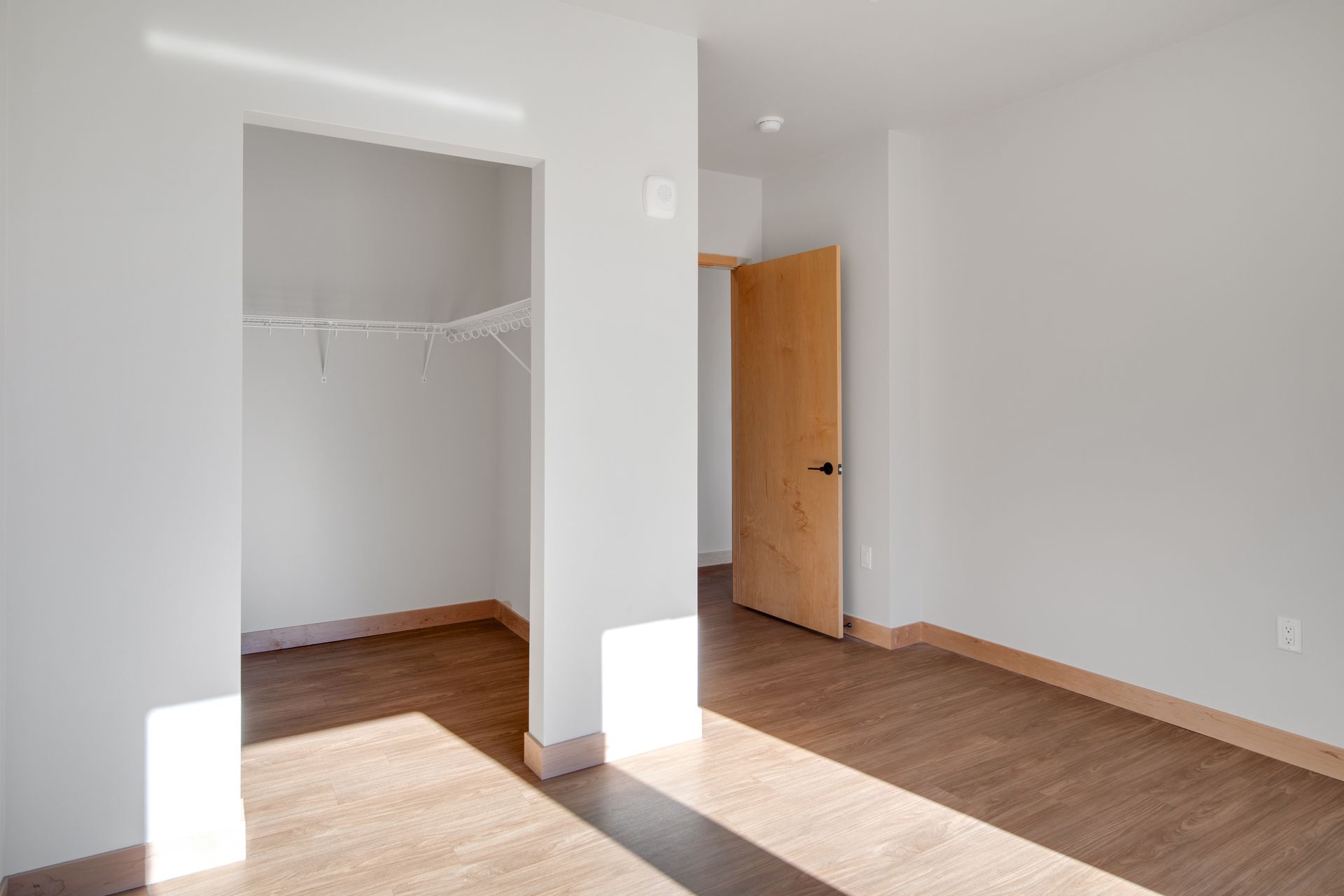 There is a closet in the middle of the room.