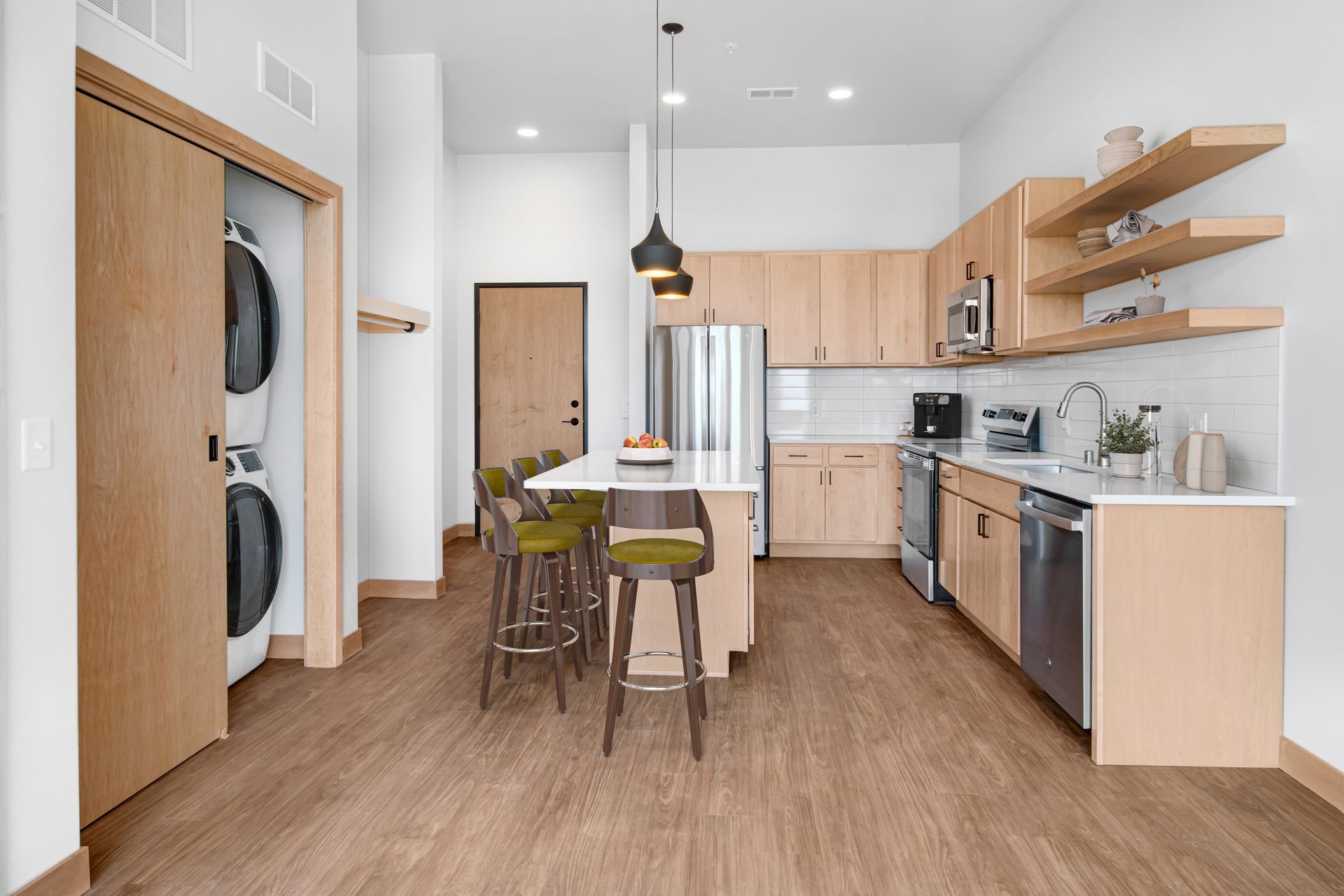 A kitchen with wooden cabinets and stainless steel appliances.