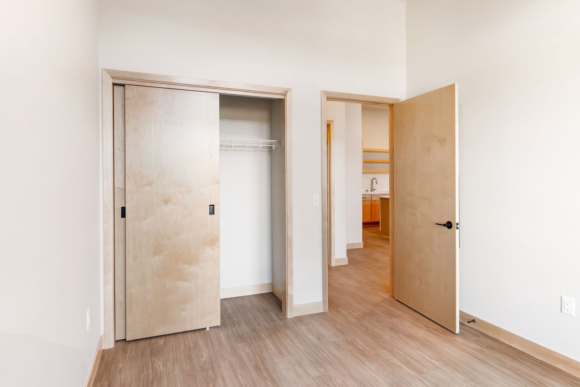 There is a closet in the middle of the room.