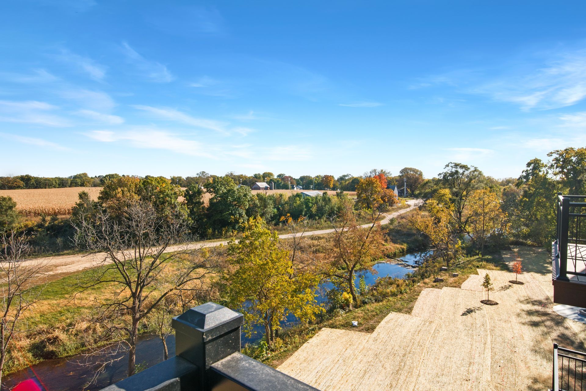 A view of a river from a balcony of a house.