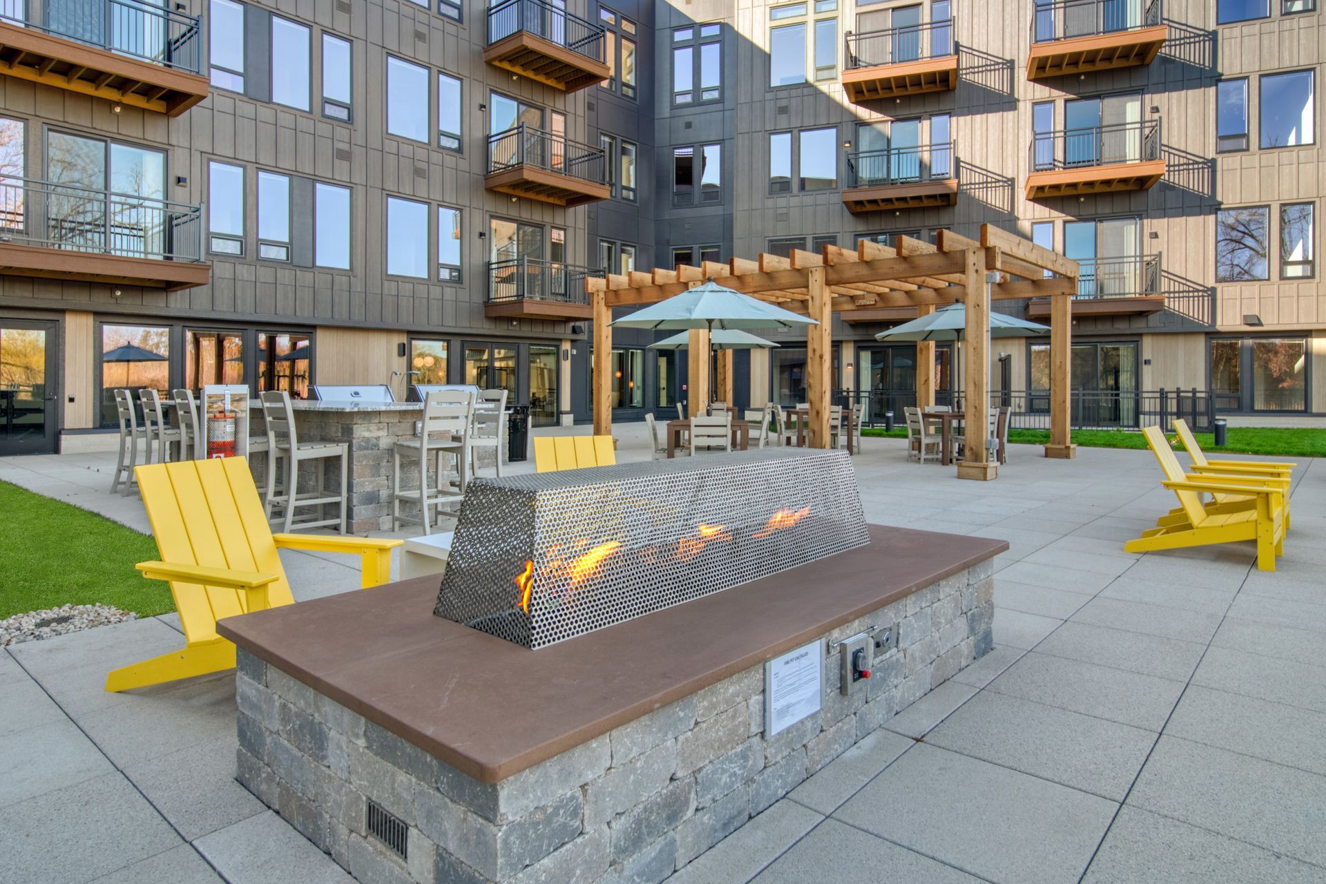 There is a fire pit in the middle of the patio.