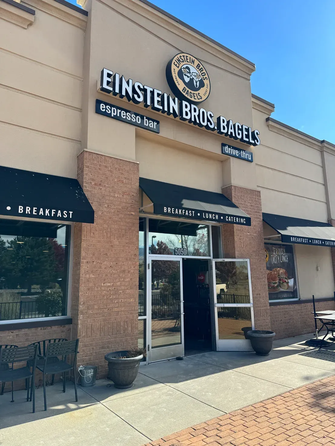 A building with a sign that says einstein bros bagels