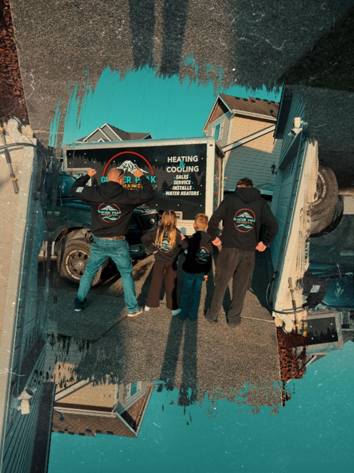 People painting a mural on a truck, with teal paint swatches and a colorful heart design on the side.