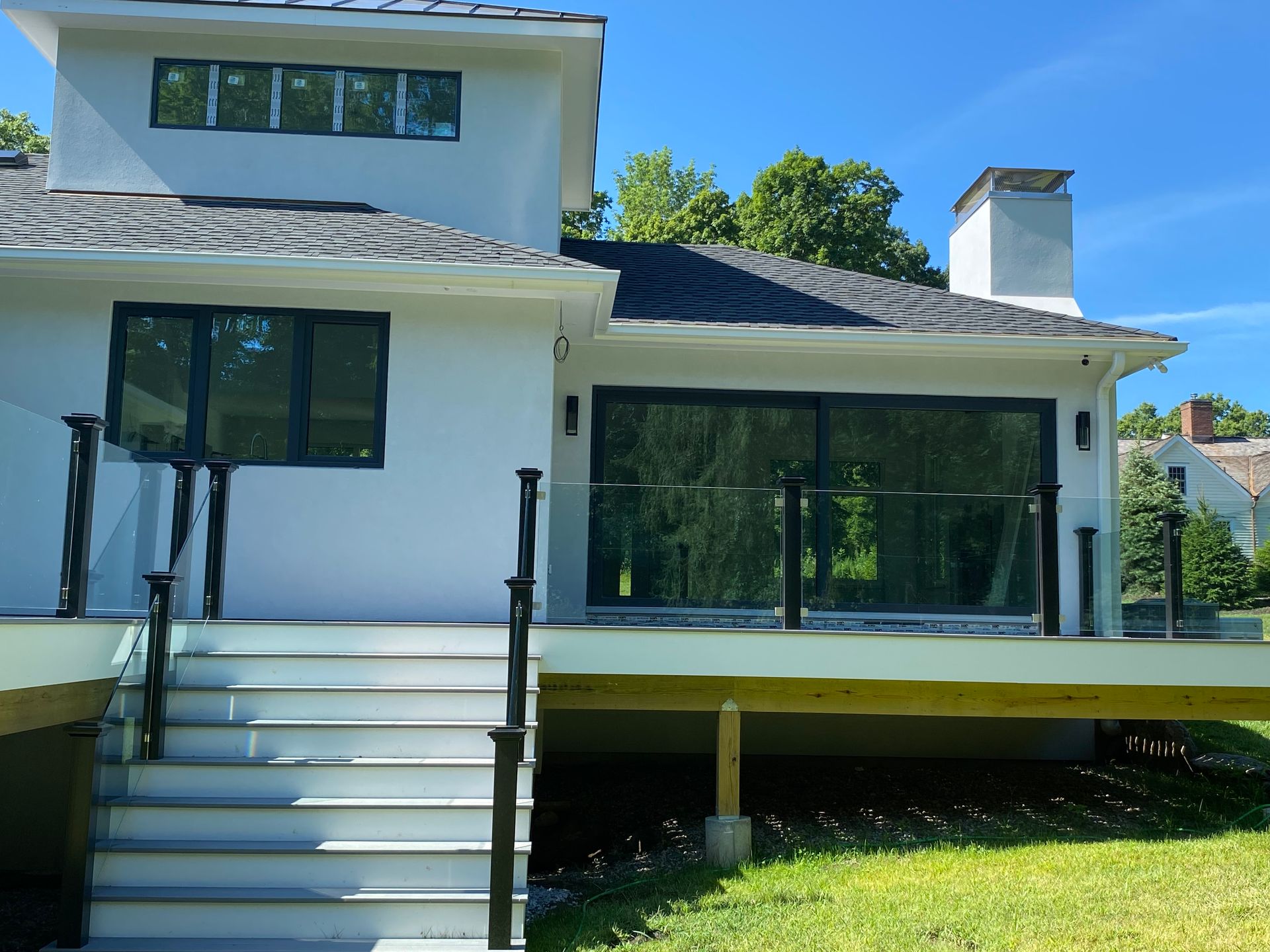 The back of a house with a deck and stairs