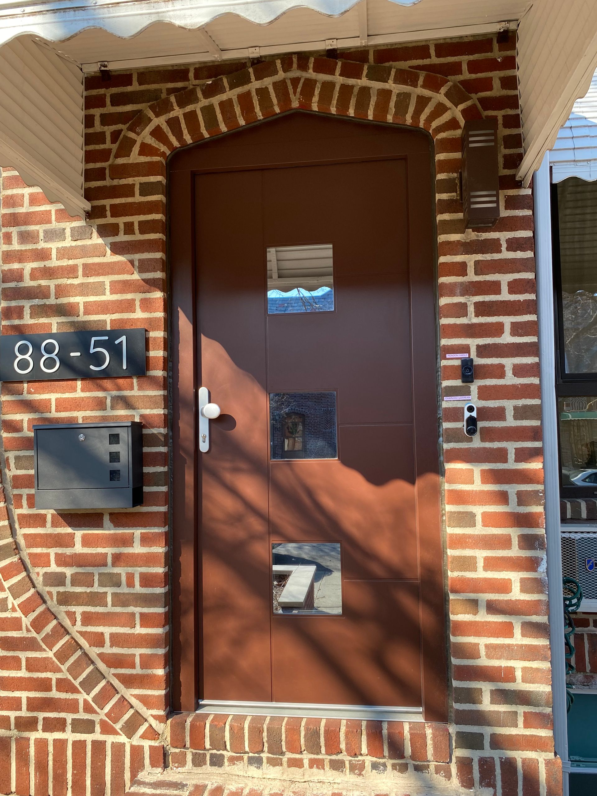 A brown door with the number 88-51 on it
