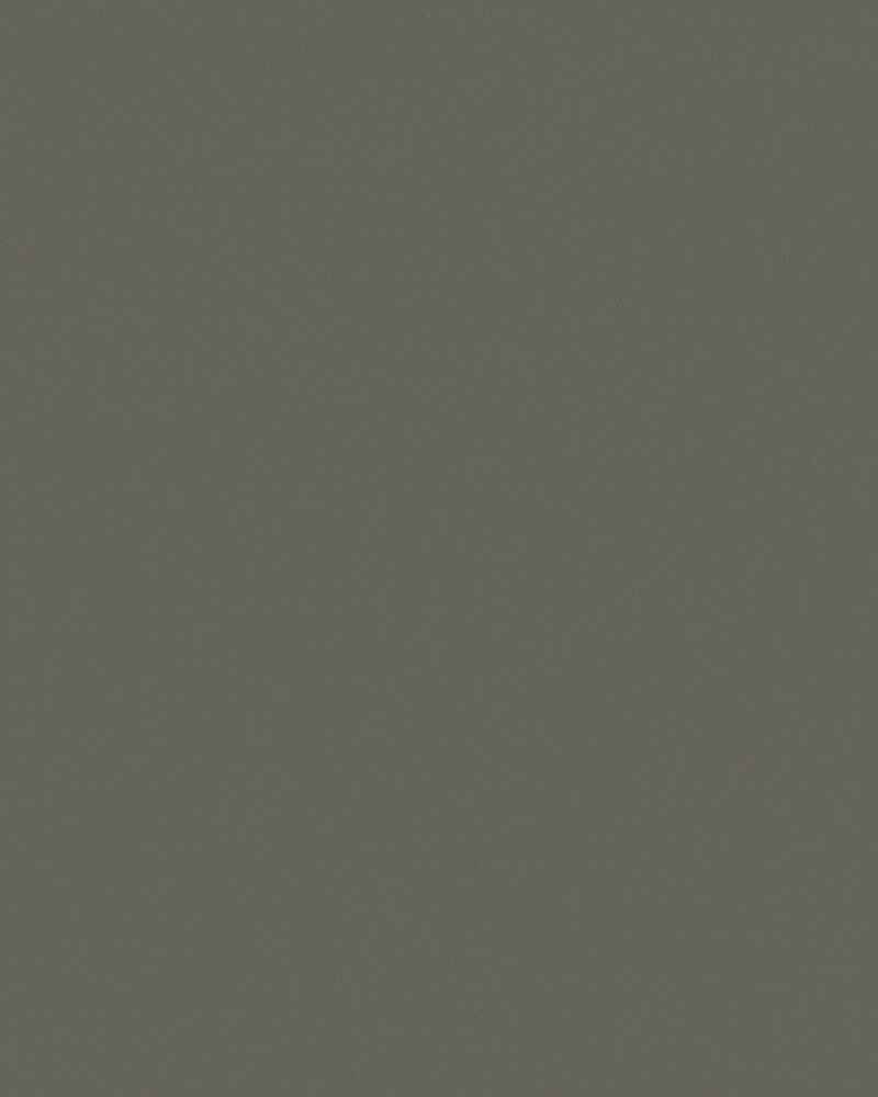 A close up of a gray paper texture.