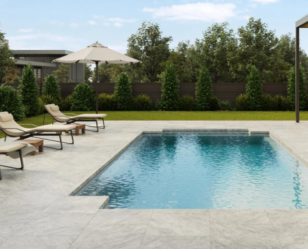 A large swimming pool surrounded by chairs and umbrellas