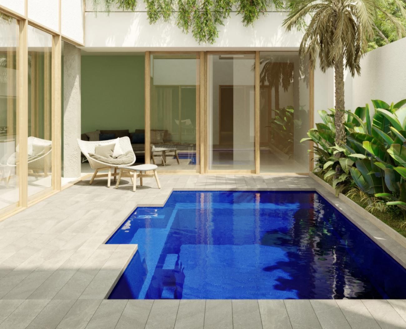 A swimming pool in the backyard of a house