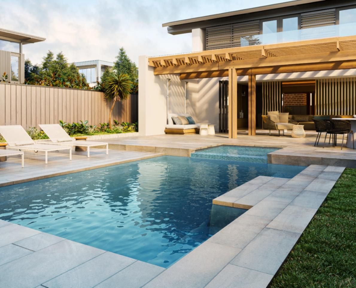 A large swimming pool in the backyard of a house