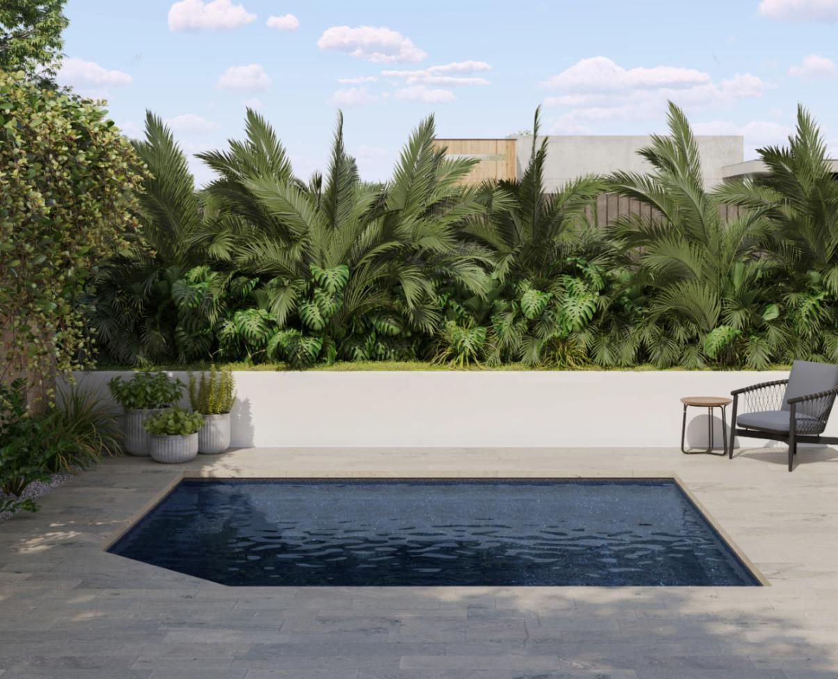 A large swimming pool is surrounded by trees and chairs