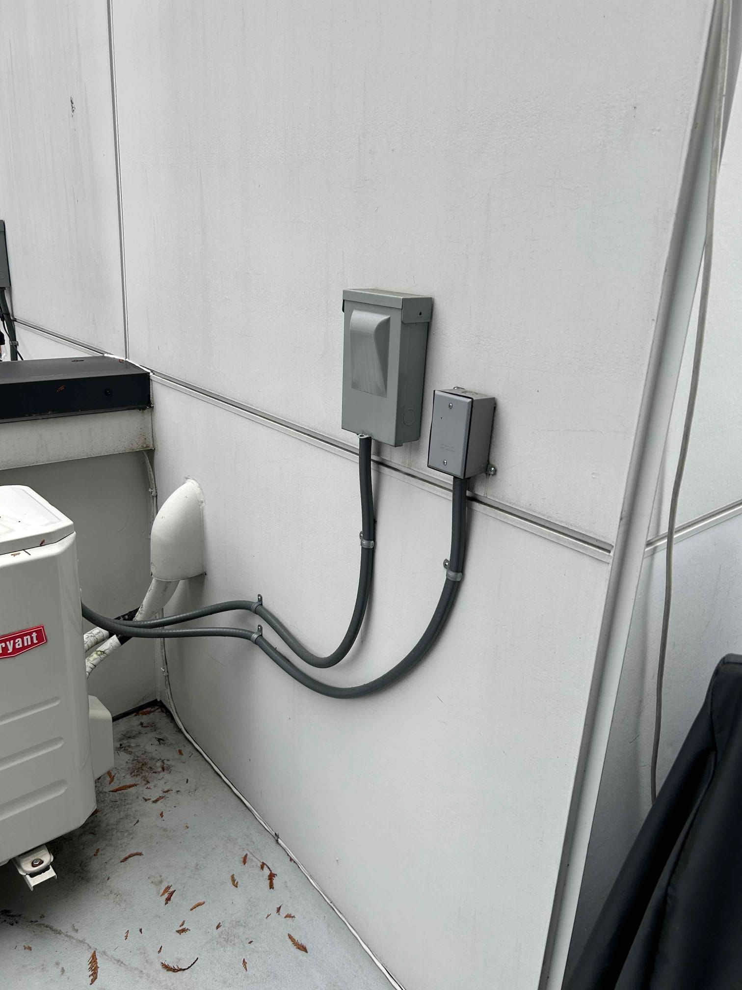 Bryant ductless mini-split outdoor unit installed by Kings Heating in Lynnwood WA with disconnect boxes