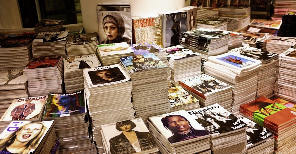 A bunch of magazines are stacked on top of each other