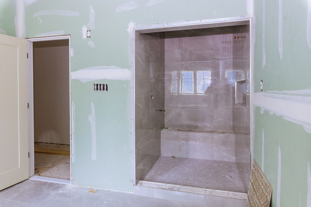 A Bathroom Under Construction With A Walk In Shower And A Bathtub — Instyle Kitchens & Coatings in Lennox Head, NSW