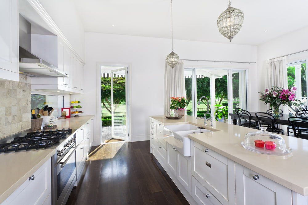 A Kitchen with White Cabinets and Stainless Steel Appliances — Instyle Kitchens & Coatings in Ballina, NSW