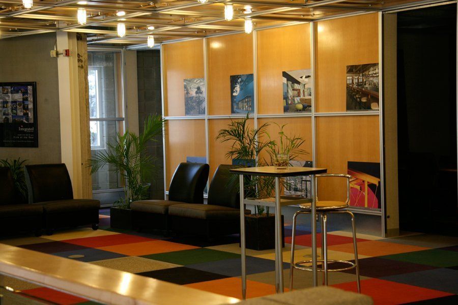 A room with a table and chairs in it