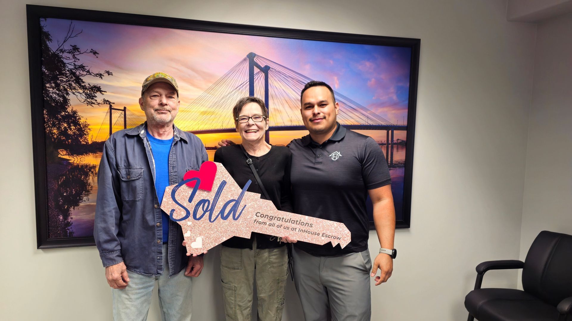 A patio with a lot of furniture and lights at night.