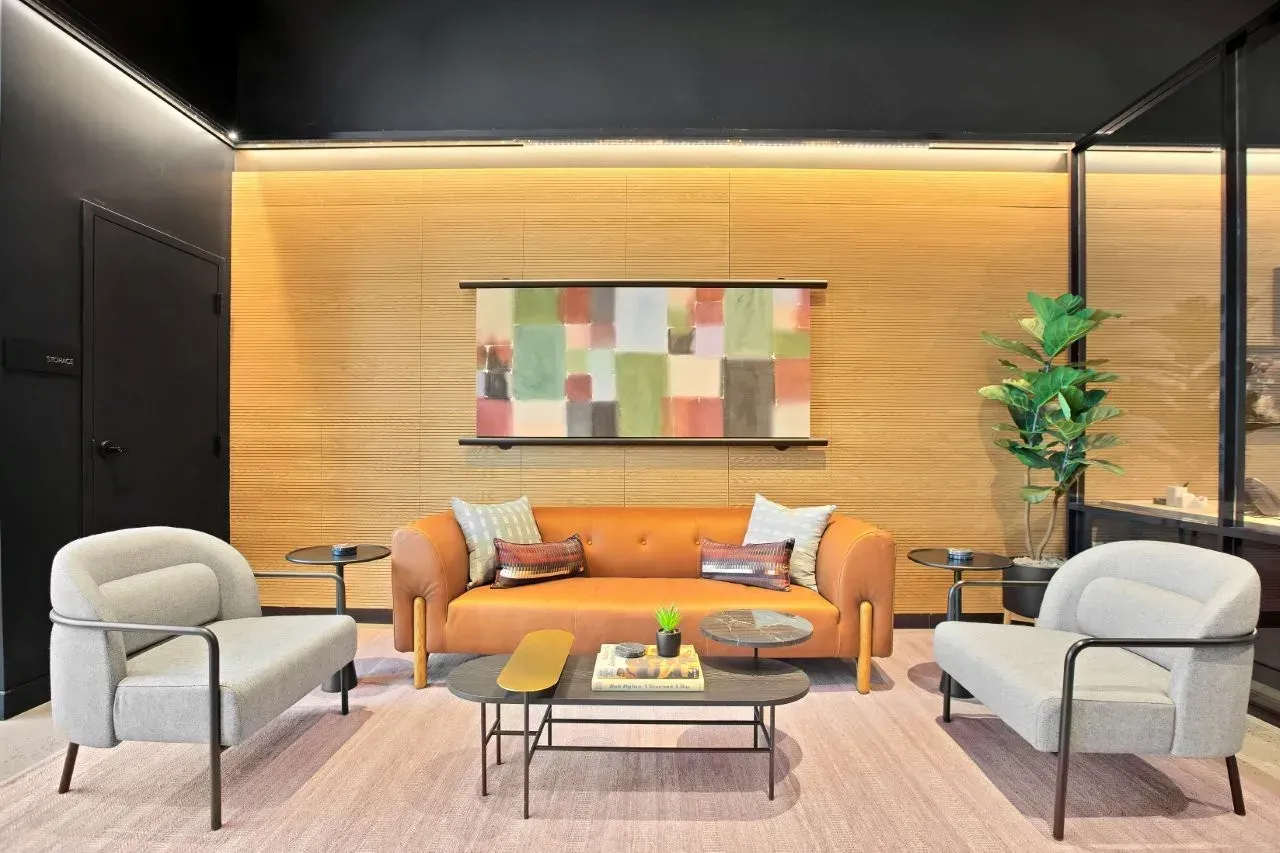 Clubhouse with a couch , chairs , and a coffee table.