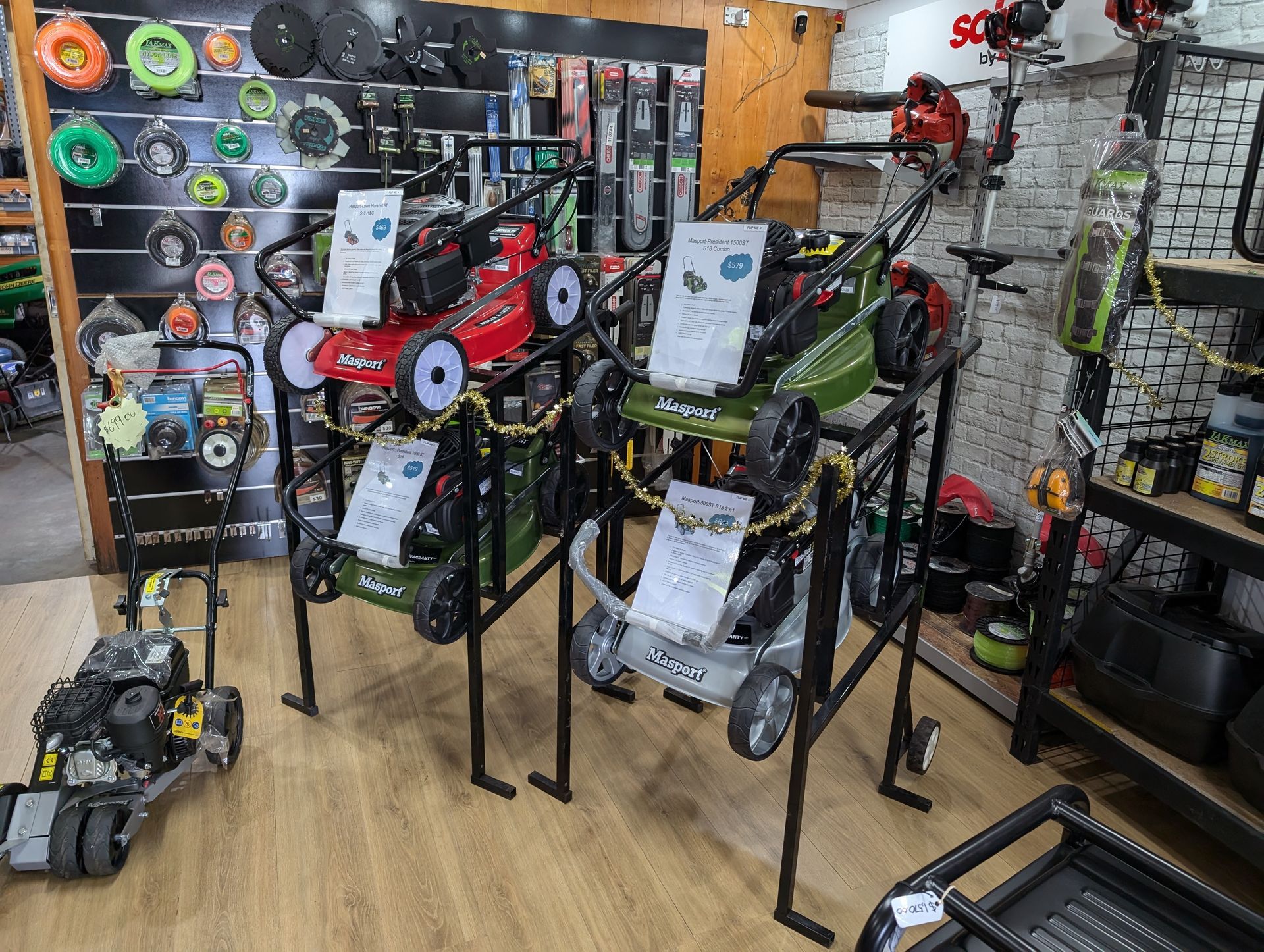 A Row Of Lawn Mowers Are On Display In A Store — Plateau Mower Repairs In Alstonville, NSW