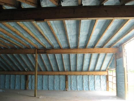 the ceiling of a building with a lot of insulation on it .
