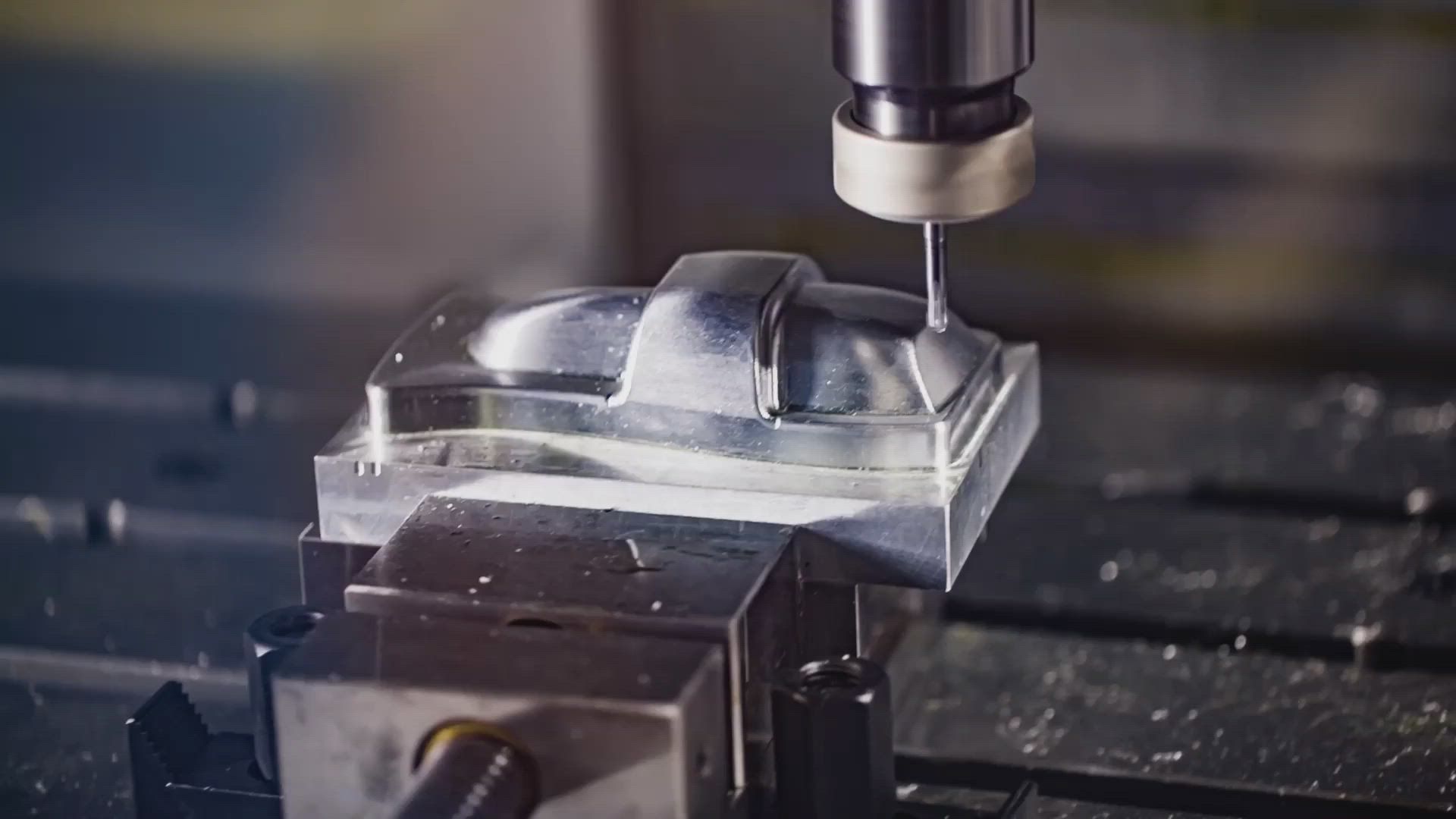 A machine is cutting a piece of metal on a table.