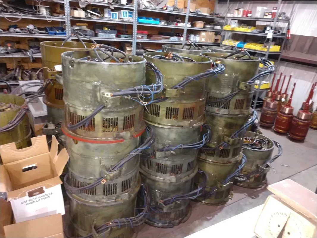 A bunch of buckets are stacked on top of each other in a warehouse