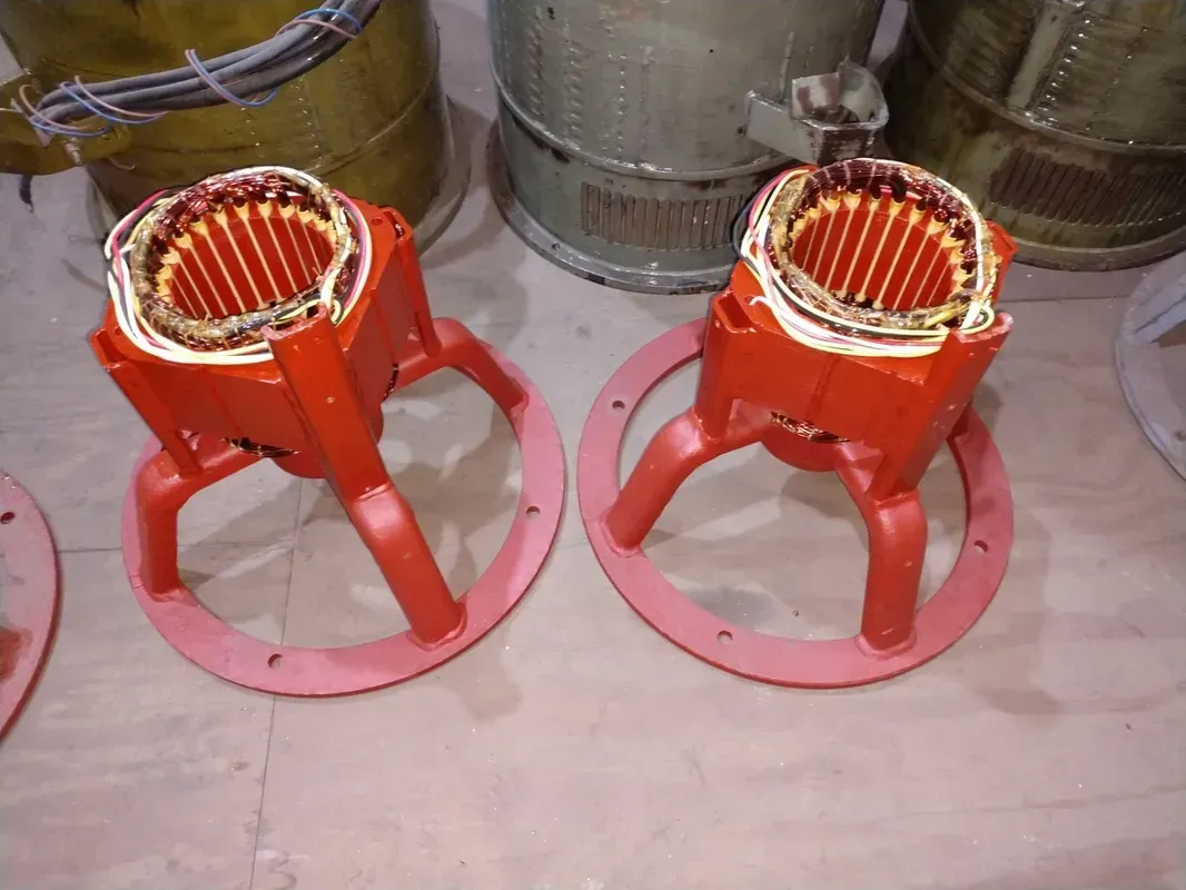 Two motors are sitting next to each other on a table.