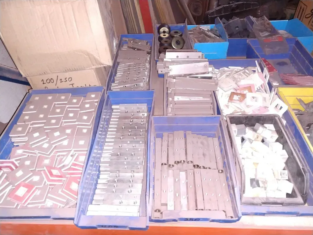 A bunch of trays filled with different types of metal