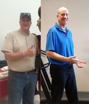 A man is giving a thumbs up and standing on a treadmill.