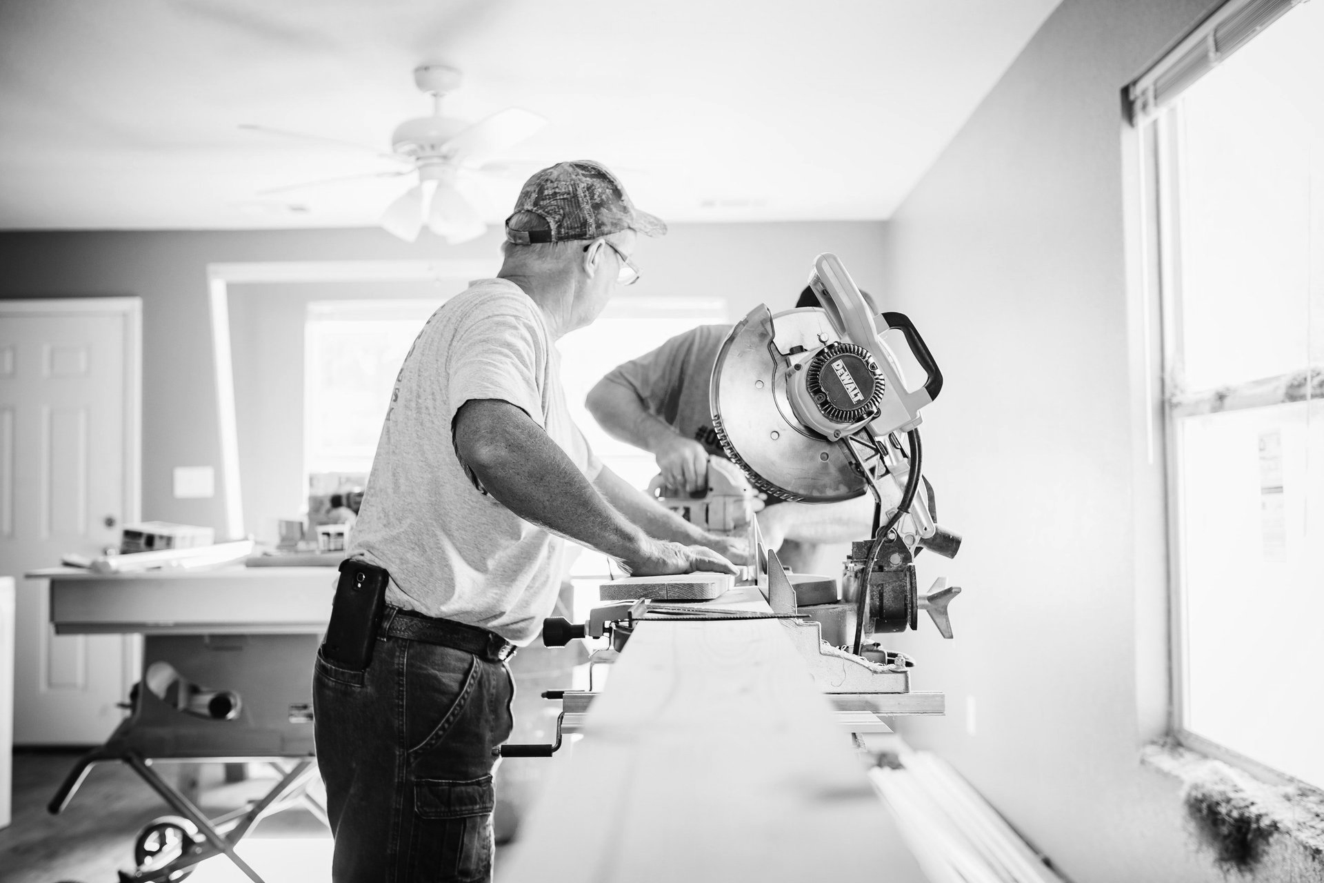 Handyman in Nashville cutting wood with a miter saw.