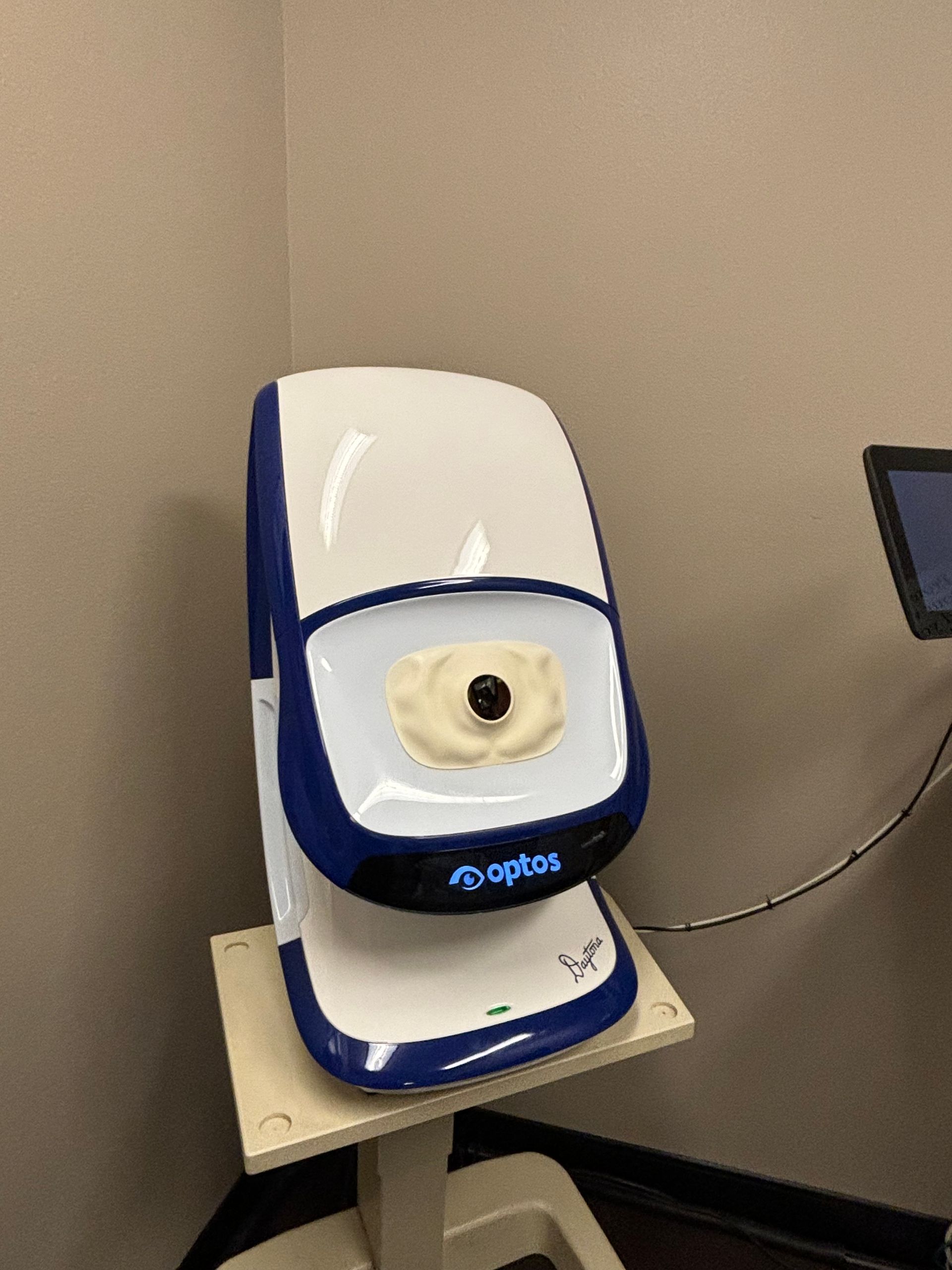 An eye examination machine is sitting on a table.