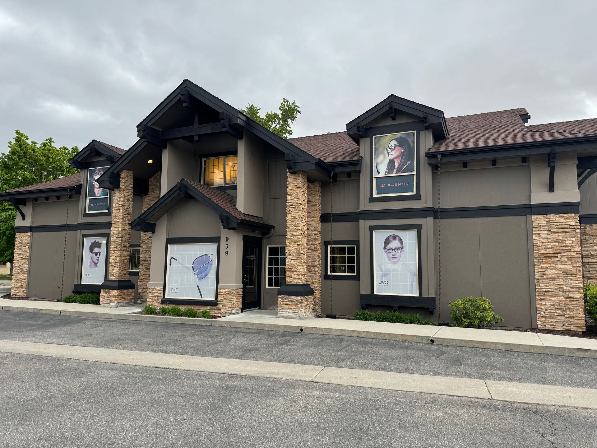 A group of people are standing around a fire pit eating food.