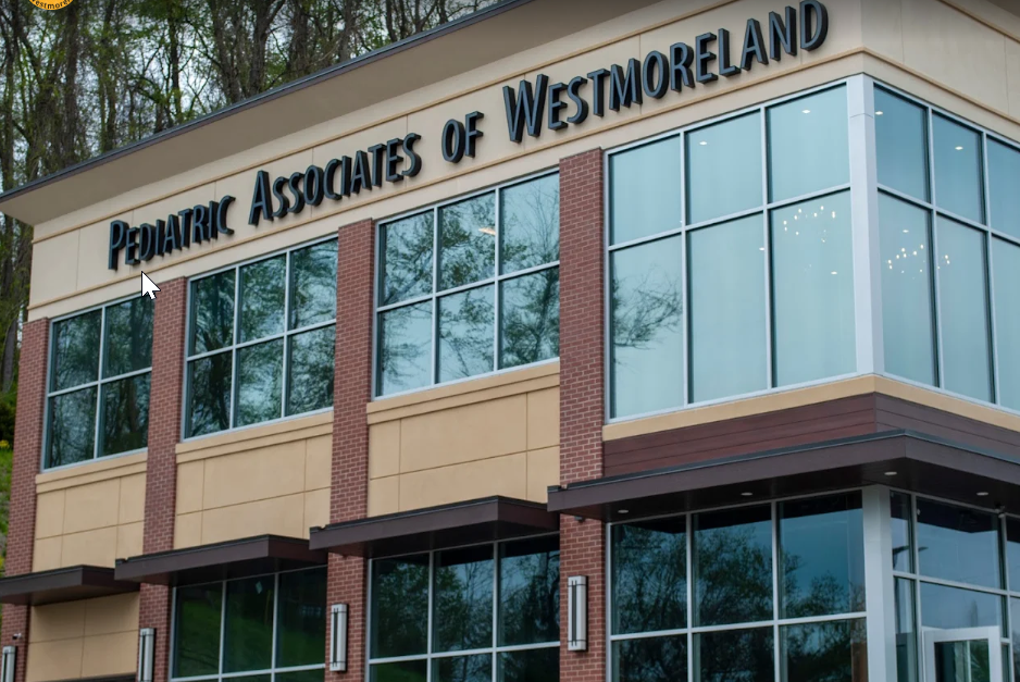 A pediatric associates of westmoreland building with lots of windows