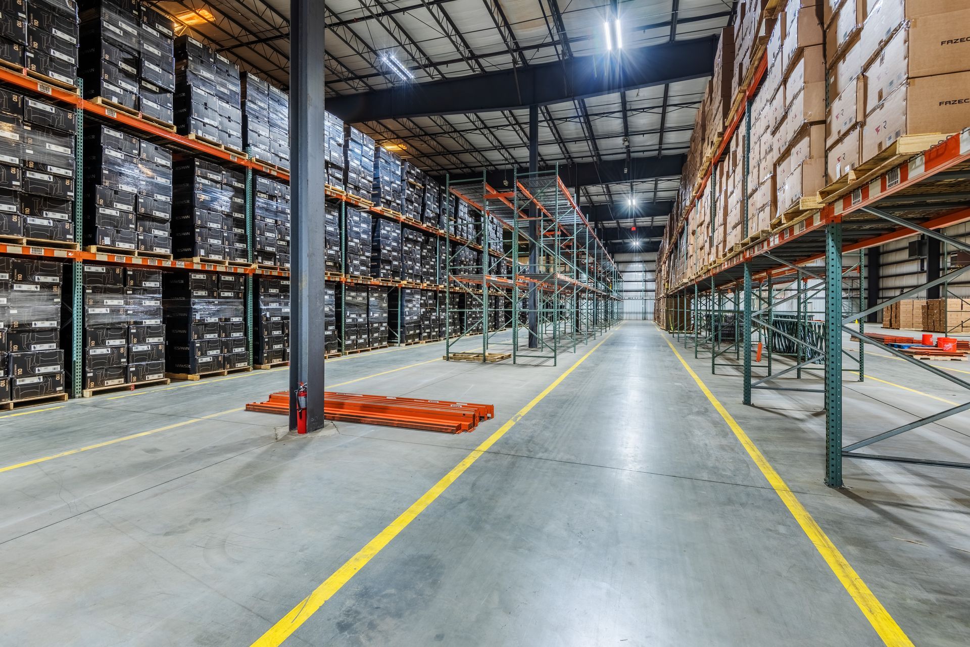 A large warehouse filled with lots of shelves and boxes.