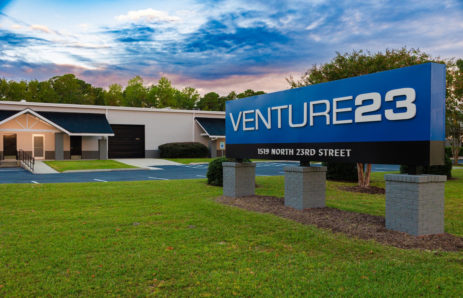 a sign for venture23 is in front of a building
