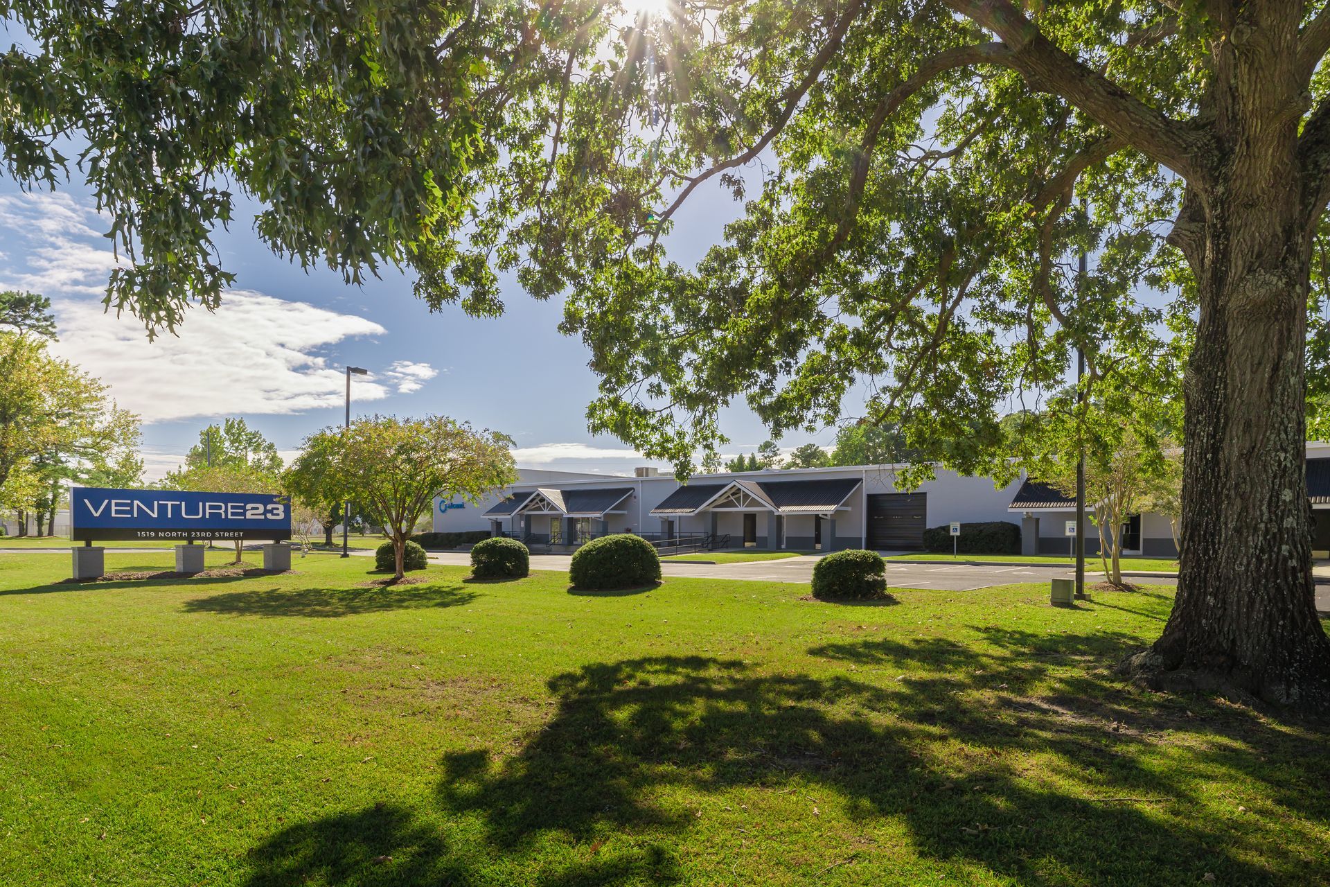 a large building with a sign that says venture23