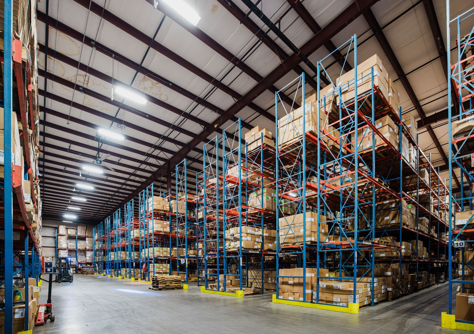 A large warehouse filled with lots of shelves and boxes