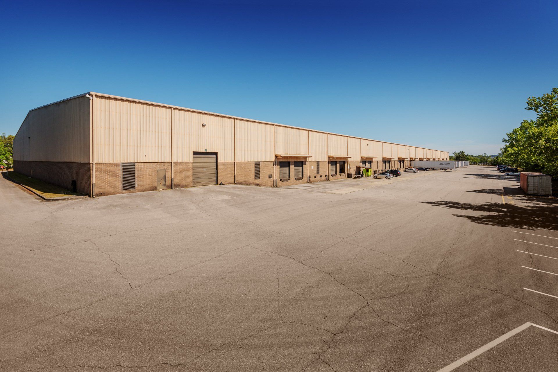 A large building with a parking lot in front of it