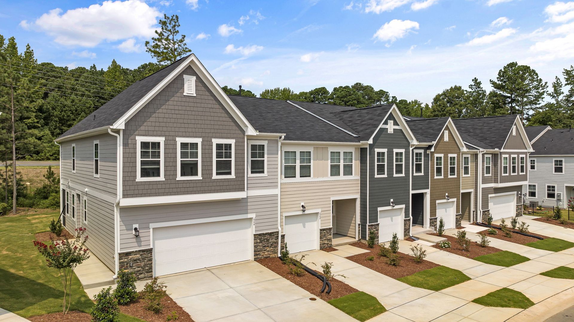 An aerial view of a row of houses in a residential area.