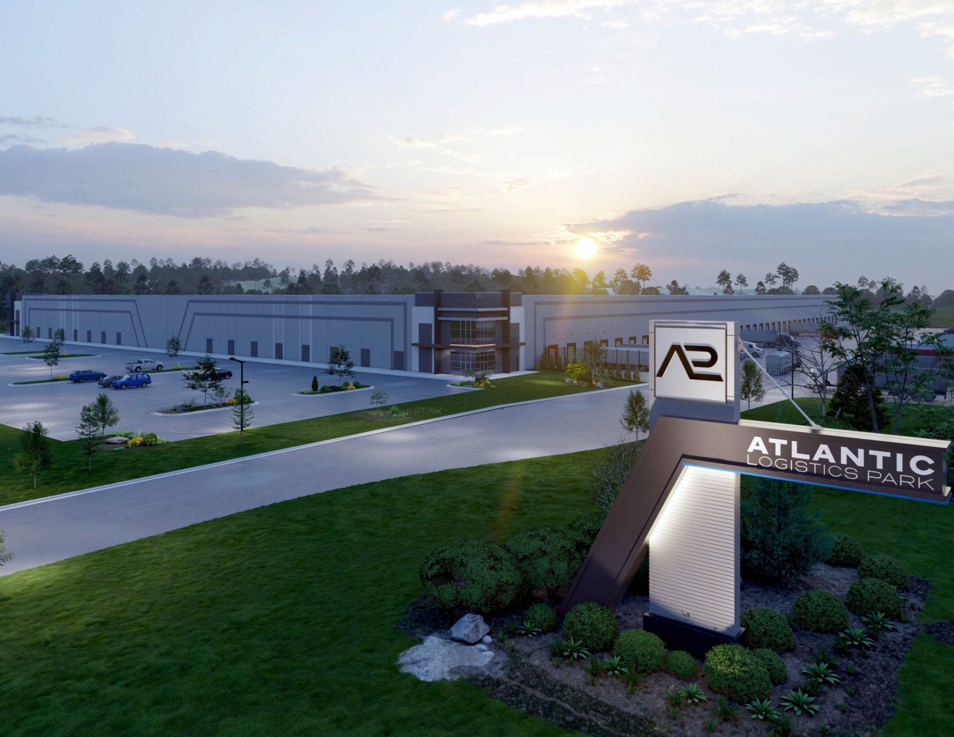 An aerial view of a large building with a sign in front of it.